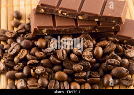 chocolate and coffee beans on a bamboo mat Stock Photo