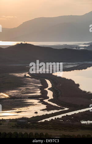 Looking across the Vrina plain wetlands at Butrint National Park, towards the Vivari channel and Butrint, Southern Albania. Stock Photo