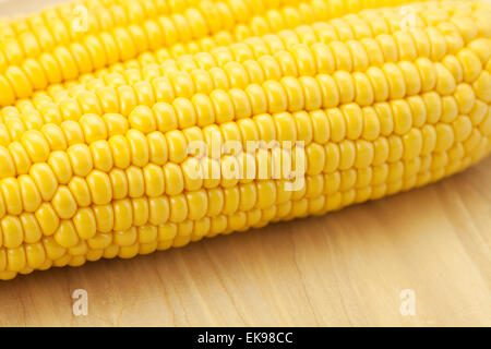 Corn lying on a cutting board Stock Photo