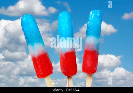 Red, white and blue popsicles with blue sky background. Stock Photo