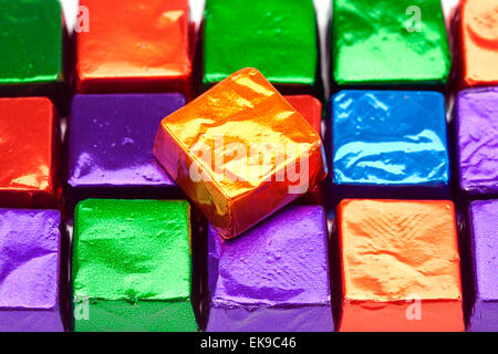 candies in shiny wrappers background Stock Photo