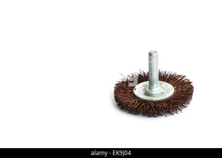 Old rotating metal brush or grinding disk isolated on white background Stock Photo