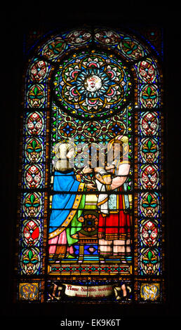 Stained glass window depicting a biblical scene: Presentation of Jesus at the Temple. Stock Photo