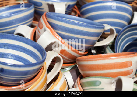 ceramic cups in a basket at the fair Stock Photo