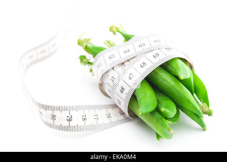 peas and measure tape isolated on white Stock Photo