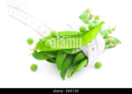 peas and measure tape isolated on white Stock Photo