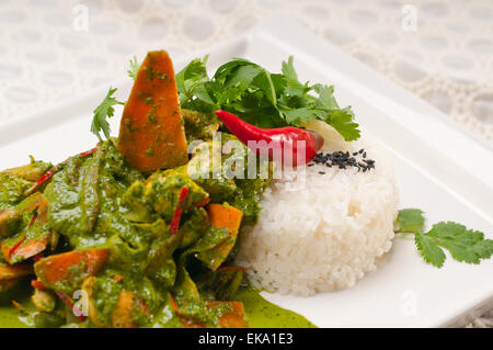 chicken with green curry vegetables and rice Stock Photo