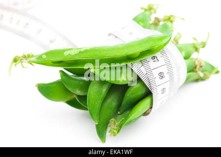 peas and measure tape isolated on white Stock Photo