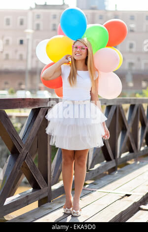 Young beautiful woman with air balloons Stock Photo