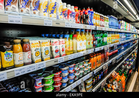 Soft drinks in the fridge of a shop Stock Photo