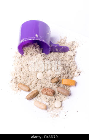 Whey protein powder in scoop with vitamins and plastic shaker on white background Stock Photo