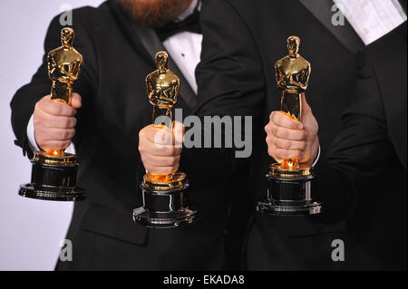 LOS ANGELES, CA - FEBRUARY 22, 2015: Trio of Oscar trophies at the 87th Annual Academy Awards at the Dolby Theatre, Hollywood. Stock Photo