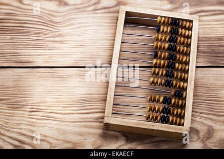 old abacus on the vintage wooden table Stock Photo