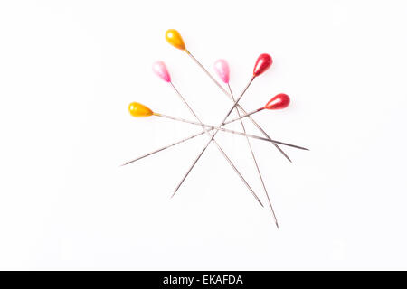 Many sewing push pins isolated on white background Stock Photo