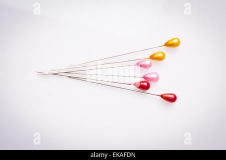 Many sewing push pins isolated on white background Stock Photo
