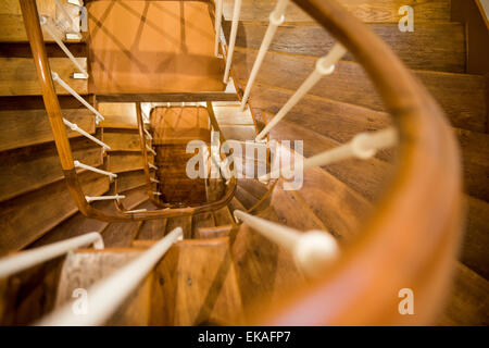 Looking down through a winding wooden staircase. Stock Photo