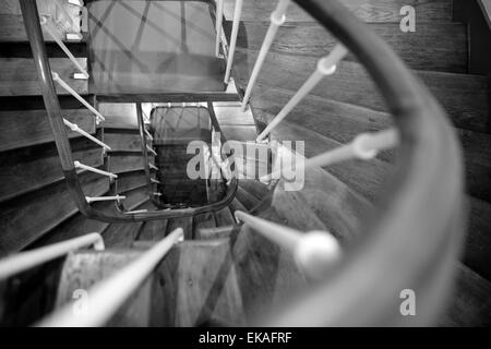 Looking down through a winding wooden staircase. Stock Photo