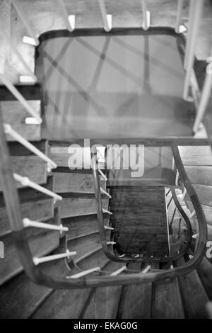 Looking down through a winding wooden staircase. Stock Photo