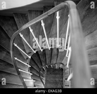 Looking down through a winding wooden staircase. Stock Photo