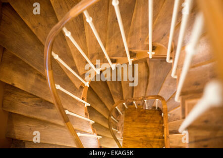 Looking down through a winding wooden staircase. Stock Photo