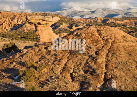 A winter scene featuring Camel Rock, an unusual earth formation which has become a landmark in the small pueblo village. Stock Photo