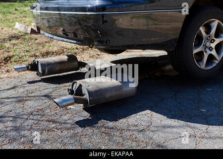 Car exhaust muffler removed - USA Stock Photo