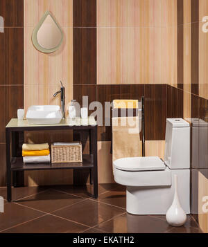 detail of a modern bathroom with sink, toilet and towel Stock Photo