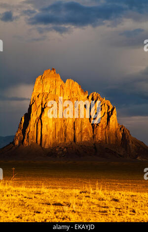 Towering seventeen hundred feet about the plain, Shiprock is the remnant of a volcanic core of basalt. Stock Photo