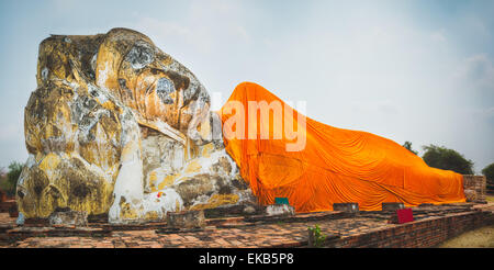 Giant Reclining Buddha in Wat Lokayasutharam. Ayutthaya historical park. Panorama Stock Photo