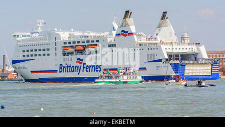 Mont St Michel cruise ship dwarfing Spirit of Gosport ferry from Brittany Ferries in Portsmouth Harbour, UK. Stock Photo