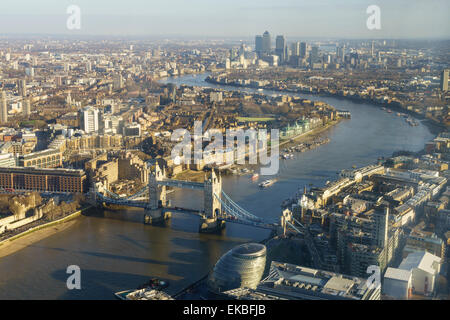 Elevated view of the River Thames looking East towards Canary Wharf with Tower Bridge in the foreground, London, England, UK Stock Photo