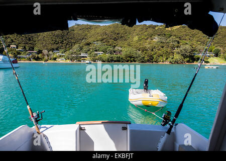 View from the back of a boat as it heads out to sea in the Bay of Islands, New Zealand. Stock Photo