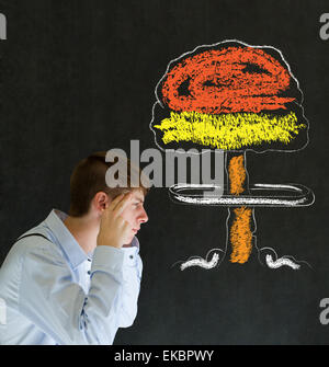 Man thinking chalk nuclear bomb cloud blackboard background Stock Photo