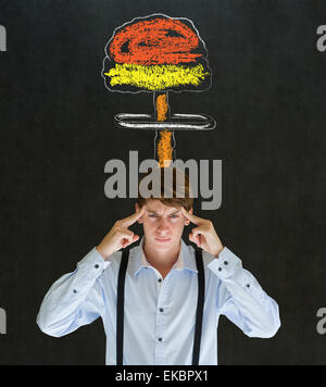 Man thinking chalk nuclear bomb cloud blackboard background Stock Photo