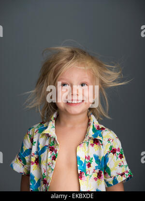 Portrait of young boy with messy hair, smiling Stock Photo