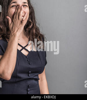 Portrait of mature woman, crying with laughter Stock Photo