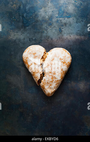 Broken heart-shaped gingerbread cookie Stock Photo