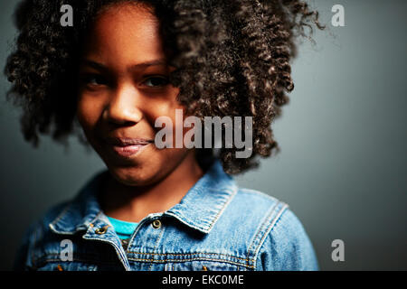Girl with afro, smiling Stock Photo