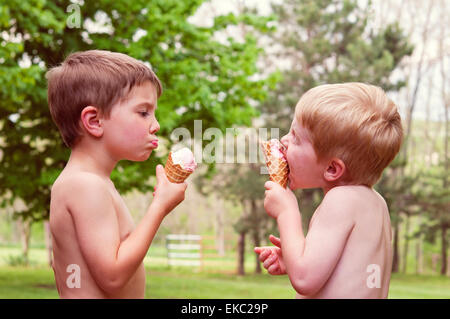 Two boys eating ice-cream Stock Photo