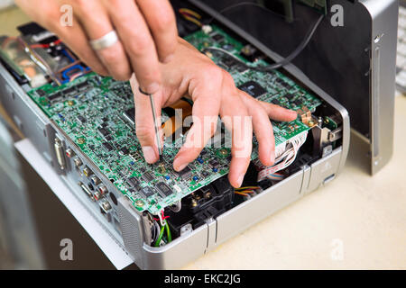 Man repairing circuit board, close up Stock Photo