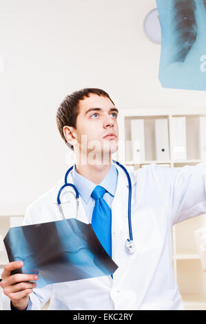 Doctor looking the x-ray Stock Photo