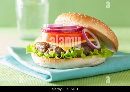 cheeseburger with beef patty cheese lettuce onion tomato Stock Photo