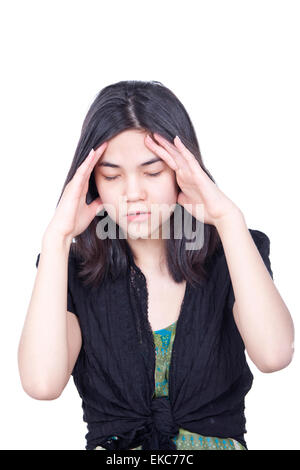 Young biracial teen girl massaging temple, face stressed or havi Stock Photo