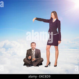 Office Girl Pointing Businessman Sitting on Clouds Stock Photo