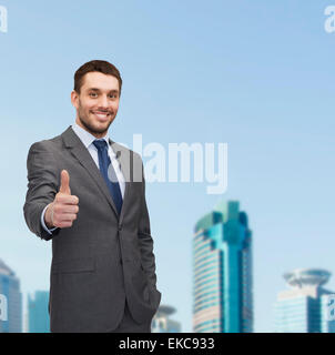 handsome buisnessman showing thumbs up Stock Photo
