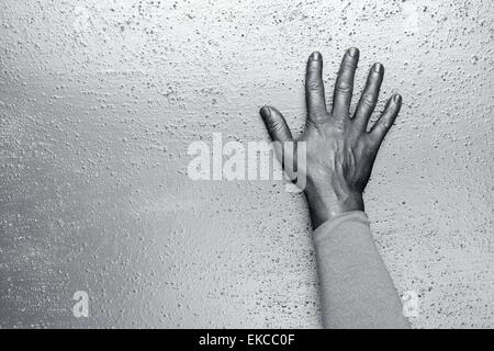 futuristic man silver hand over textured steel Stock Photo