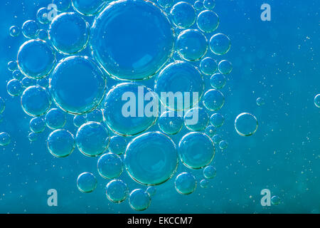 Oil soils on water surface, close-up. Stock Photo