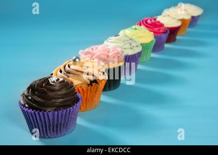 Cupcakes colorful cream muffin arrangement Stock Photo
