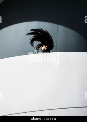 Young woman throwing her head back Stock Photo