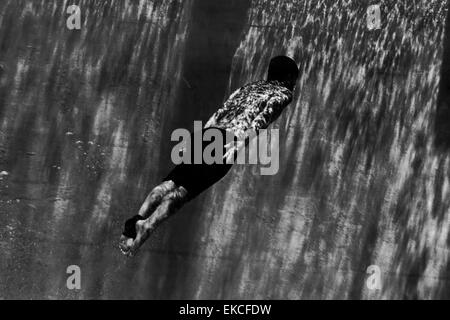 Man swimming underwater Stock Photo